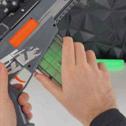 Loads and fires the Gray Sentinel rifle; a casing ejects.