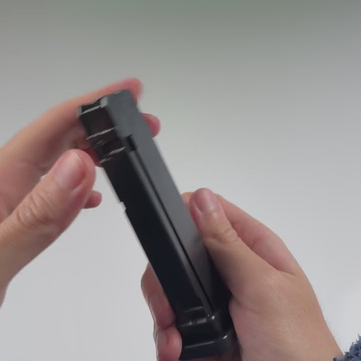 A casing is loaded into the black replacement clip.