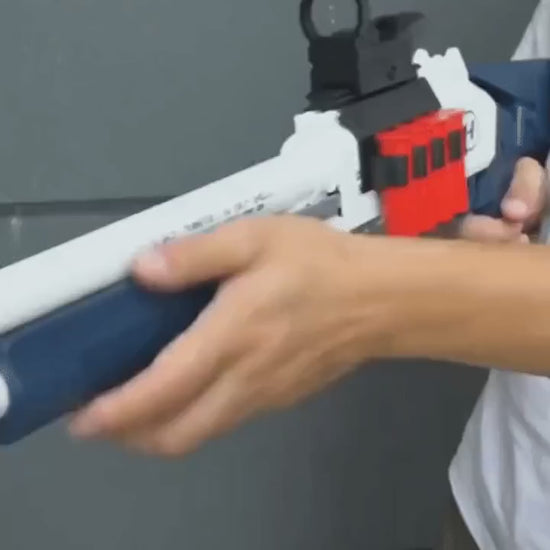 Loads the blue-and-white Atlas, aims, fires, and ejects a red casing.