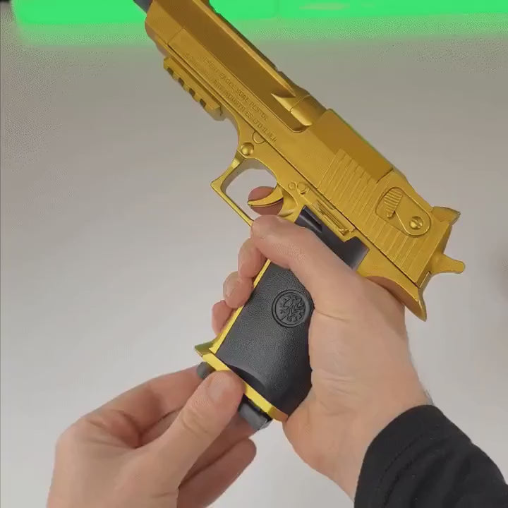 Loads and fires the gold Bigblaster; a gold casing ejects.