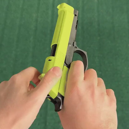 The Green Emerald fires; the casing and dart action are visible.