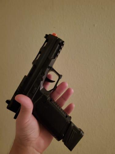 Black shellblaster held in a customer photo